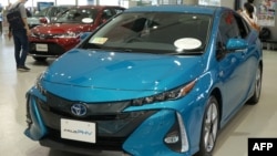 Toyota Motor's latest cars are exhibited at their showroom in Tokyo on Aug. 3, 2018. The Japanese car giant on Aug. 3, 2018, said its first quarter net profit rose 7.2 percent.