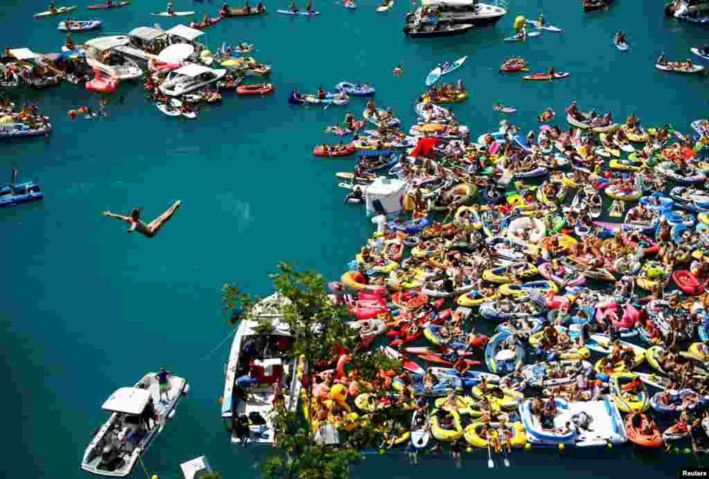 Andy Jones of U.S. dives from a 27-meter high platform overlooking Lake Lucerne during the finals of the Red Bull Cliff Diving series in Sisikon, Switzerland, Aug. 4, 2018.