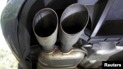 FILE - The exhaust system of a Volkswagen Passat TDI diesel car is seen in Esquibien, France, Sept. 23, 2015. 