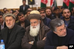 Former Afghan warlord Abdul Rasool Sayyaf, center, attends the inauguration of the Afghanistan Protection and Stability Council in Kabul, Afghanistan, Dec. 18, 2015.