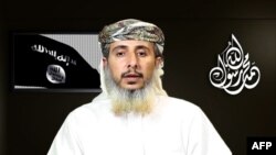 FILE - A speaker is seen in a propaganda video posted online on Jan. 14, 2015, by the media arm of Al-Qaida in the Arabian Peninsula. One analyst says the U.S. travel ban provides a narrative for jihadists that plays into their thinking.