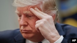 President Donald Trump listens during a meeting on health care in the Roosevelt Room of the White House in Washington, March 13, 2017.