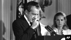 In this file photo on August 9, 1974, Richard Nixon bids farewell to his Cabinet, aides, and staff.