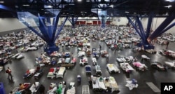 Evacuees escaping the floodwaters from Tropical Storm Harvey rest at the George R. Brown Convention Center that has been set up as a shelter in Houston, Texas, Aug. 29, 2017.