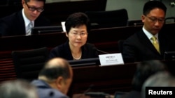 FILE - Hong Kong Chief Secretary Carrie Lam looks on during a meeting on proposing electoral reforms at the Legislative Council in Hong Kong. Carrie Lam and her Hong Kong government colleagues have been facing increased scrutiny in the U.S. capital for their handling of recent political unrest in the autonomous Chinese territory.