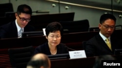 FILE - Carrie Lam looks on during a meeting on proposing electoral reforms at the Legislative Council in Hong Kong.