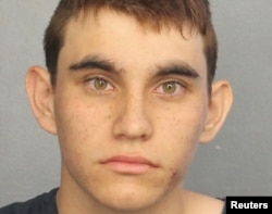 Nikolas Cruz appears in a police booking photo after being charged with 17 counts of premeditated murder following a Parkland school shooting, at Broward County Jail in Fort Lauderdale, Florida, Feb. 15, 2018.