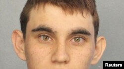 Nikolas Cruz appears in a police booking photo after being charged with 17 counts of premeditated murder following a Parkland school shooting, at Broward County Jail in Fort Lauderdale, Florida, Feb. 15, 2018.