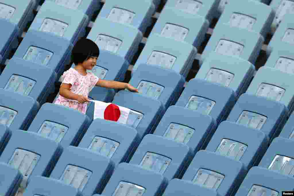 A child is seen in the stands during women&#39;s soccer as New Zealand takes on Sweden in the Tokyo 2020 Olympics at Miyagi Stadium, Miyagi, Japan.