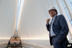 FILE - Spanish-born architect Santiago Calatrava poses for a portrait during a media tour of the World Trade Center transportation hub in New York.