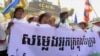Land grabbing victims mark the 29th World Habitat Day by demanding a speedy solution to their problems. Holding a banner that reads “Voices of the Urban Poor”, they walked to the National Assembly in Phnom Penh to submit a petition to the government. (VOA / S. Heimkhemra)
