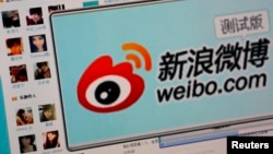 FILE - The logo of Sina Corp's Chinese microblog website 'Weibo' is seen on a screen in this photo illustration taken in Beijing.