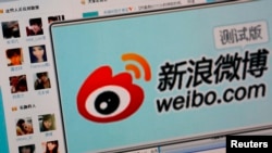 FILE - The logo of Sina Corp's Chinese microblog website "Weibo" is seen on a screen in this photo illustration taken in Beijing.