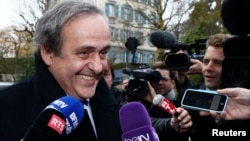 UEFA President Michel Platini smiles as he arrives for a hearing at the Court of Arbitration for Sport (CAS) in Lausanne, Switzerland, Dec. 8, 2015. 