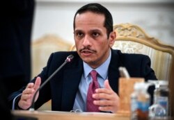 FILE - Qatar's Deputy Prime Minister and Foreign Minister Sheikh Mohammed bin Abdulrahman Al-Thani gestures as he speaks during talks in Moscow, Russia, Sept. 11, 2021.