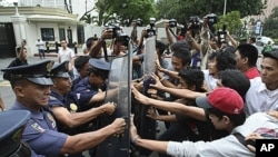 Protesters clash with riot police and U.S. Embassy guards as the former rush towards the embassy gates to protest the joint U.S.-Philippines military exercises dubbed "Balikatan 2011," which opened in Manila, Philippines, April 5, 2011.