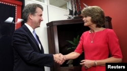 FILE - U.S. Supreme Court nominee Brett Kavanaugh meets with Senator Lisa Murkowski (R-AK) on Capitol Hill in Washington, Aug. 23, 2018.