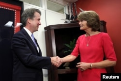 FILE - U.S. Supreme Court nominee Brett Kavanaugh meets with Sen. Lisa Murkowski, R-Alaska, on Capitol Hill in Washington, Aug. 23, 2018.