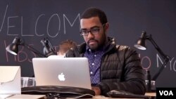 A former Harvard Business School student works on a project in the Manhattan offices of the HBS StartUp Studio