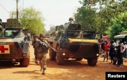 FILE - A French soldier patrols the northern district of Bangui in the Central African Republic in December 2013.