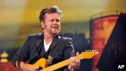 John Mellencamp performs during the Farm Aid 2013 concert at Saratoga Performing Arts Center in Saratoga Springs, N.Y., Sept. 21, 2013.