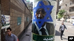 Poster created by the Egyptian Islamic Labour Party depicts former presidential candidate, and Egypt's former Vice President, Omar Suleiman, with the Star of David on his face, Cairo, April 12, 2012.