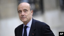 New French Defense Minister Alain Juppe arrives for the first weekly meeting of a reshuffled French government, Paris, 17 November 2010