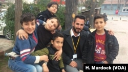 Boys in Reyhanli, Turkey pose for a picture, saying they are often afraid of rockets hitting their homes in Turkey, after they fled Syria for safety on Feb. 4, 2018. 