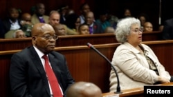 Former South African president Jacob Zuma, left, and accused company Thales, represented by Christine Guerrier, right, appear at the KwaZulu-Natal High Court in Durban, South Africa, April 6, 2018.