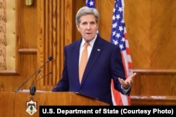 U.S. Secretary of State John Kerry addresses reporters during a joint news conference with Jordanian Foreign Minister Nasser Judeh, not shown, following a bilateral meeting in Amman, Feb. 21, 2016.