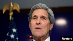 U.S. Secretary of State John Kerry announces he will visit Paris later in the week, at a news conference in Gandhinagar, India, Jan. 12, 2015.