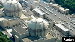 FILE - An aerial view shows Kansai Electric Power Co's Ohi nuclear power plant's No. 4 reactor (front) in Ohi, Fukui prefecture, July 2012.