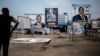 A man looks at campaign posters in the district of Lingwala in Kinshasa, DRC, Dec. 18, 2018.
