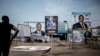 FILE - A man looks at campaign posters in the district of Lingwala in Kinshasa, DRC, Dec. 18, 2018.