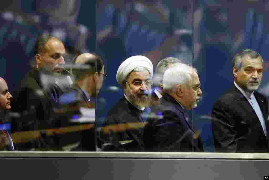 President Hassan Rouhani of Iran (center) walks with Iranian Foreign Minister Mohammad Javad Zarif, second right, as he leaves after addressing the 69th session of the United Nations General Assembly at U.N. headquarters, New York, Sept. 25, 2014. 
