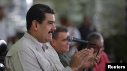 Venezuela's President Nicolas Maduro attends an event with workers in Caracas, Nov. 14, 2017.