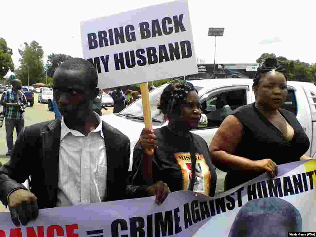 Sheffra Dzamara and supporters at one year anniversary of husband's disappearance