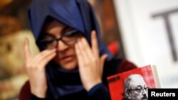 FILE - Hatice Cengiz, Turkish fiancee of slain Saudi journalist Jamal Khashoggi, attends a news conference to present a book on Khashoggi, in Istanbul, Turkey, Feb. 8, 2019.
