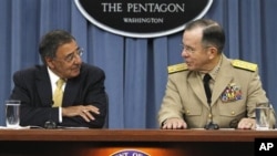 Defense Secretary Leon Panetta, left, and Joint Chiefs Chairman, Adm. Mike Mullen, brief the media at the Pentagon in Washington, on Sept. 20, 2011.