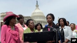 American University student government president Taylor Dumpson speaks during a news conference on Capitol Hill in Washington, Thursday, May 4, 2017. Several bananas hanging from nooses were found on the AU campus on Monday, May 1, 2017, just after Dumpson became the school's first black student government president. (AP Photo/Susan Walsh)