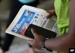 An applicant attends a jobs fair in Miami Lakes, Fla., July 28, 2016.