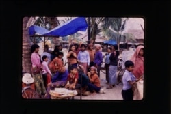 Villagers and survivors of the Khmer Rouge regime congregate in Cambodia in 1981. (Courtesy of the Documentation Center of Cambodia Archives)