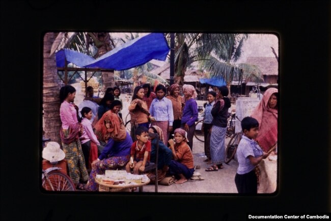Villagers and survivors of the Khmer Rouge regime congregate in Cambodia in 1981. (Courtesy of the Documentation Center of Cambodia Archives)