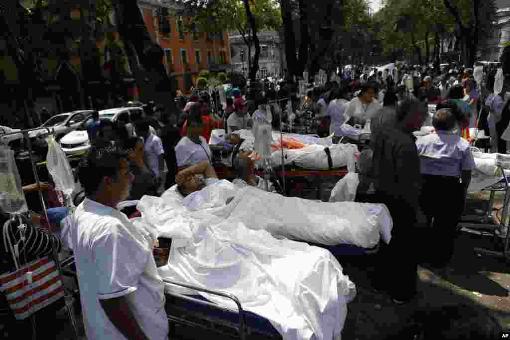 Patients lie on their hospital beds after being evacuated following an earthquake in Mexico City, Sept. 19, 2017.
