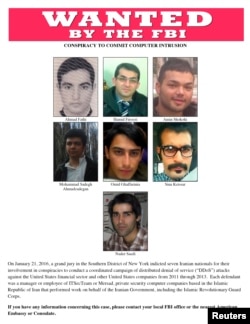 A most wanted poster provided by the FBI shows the Iranian hackers wanted for a coordinated campaign of cyber attacks in 2012 and 2013 on several U.S. banks and a New York dam, at the Justice Department in Washington, March 24, 2016.