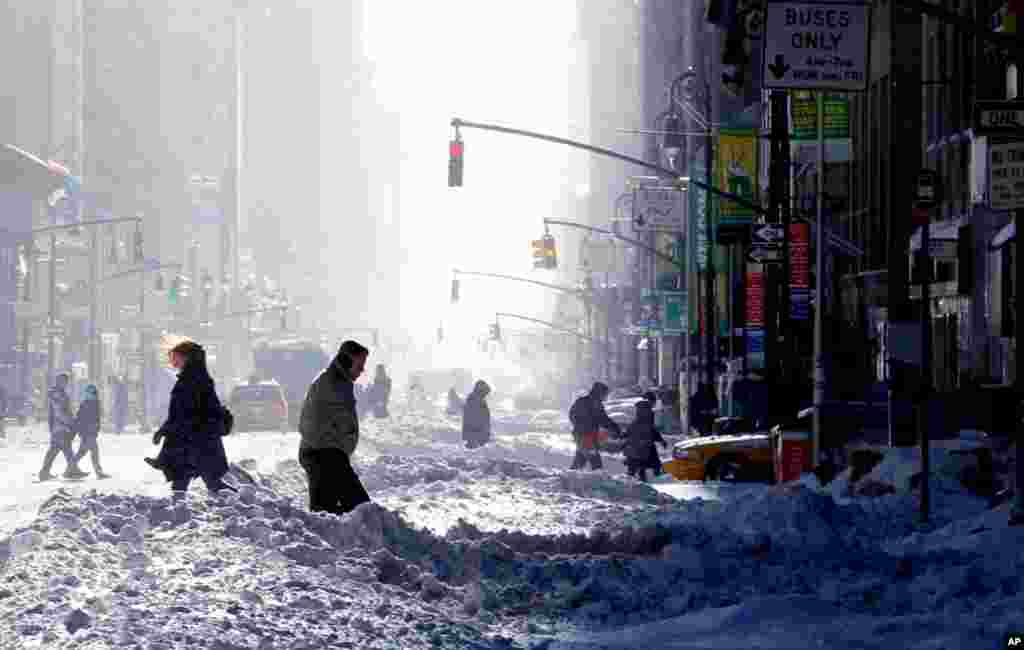 Dec. 27: People walk the streets in Manhattan after a major snowstorm hit the New York City area. (Gary Hershorn/Reuters)