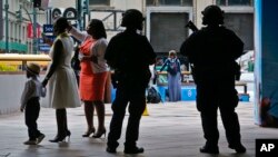 A New York Police Department anti-terror unit guard an entry area to Madison Square Garden as families arrive for a graduation ceremony, May 23, 2017, in New York. 