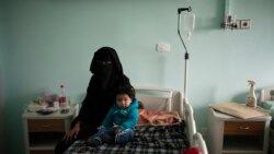 Yazan, 1, sits with his mother before his heart surgery at the Tajoura National Heart Center in Tripoli, Libya, on Feb. 27, 2020.