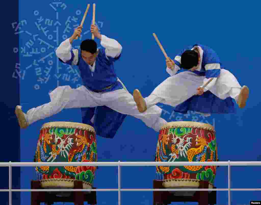 Drummers perform prior to the women&#39;s ice hockey match between Sweden and Switzerland at Kwandong Hockey Center in Gangneung, South Korea.