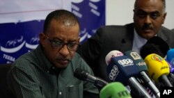 Sudanese civil society activist Omer Eldigair, left, one of the leaders from the protest movement, gives a press conference in the capital Khartoum, April 24, 2019.